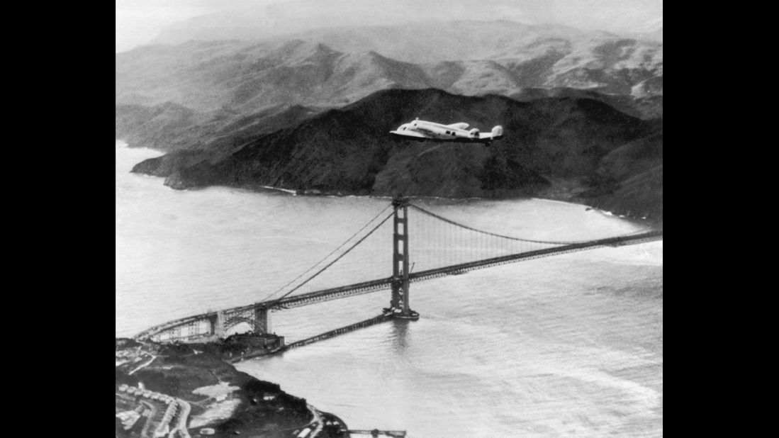 The Lockheed Electra piloted by Amelia Earhart and Fred Noonan flies over the Golden Gate Bridge at the start of a round-the-world flight on March 17, 1937. The two vanished during a similar flight in 1937.