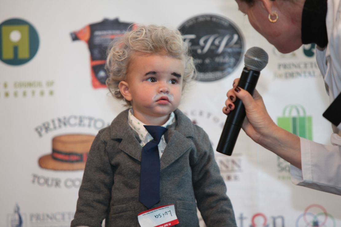 In Princeton, New Jersey, a child dresses up as Albert Einstein for Pi Day 2013.