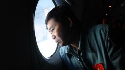 A pilot on board a Vietnamese Air Force Russian-made AN-27 searches Vietnam's southern sea for missing Malaysia Airlines' flight MH370 on March 14, 2014.