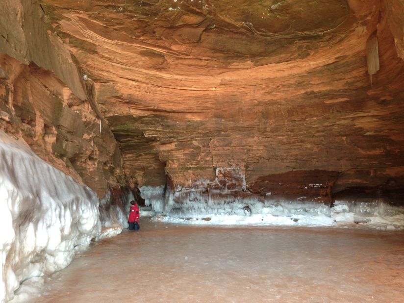 Rowlands sits on frozen Lake Superior in an ice cave referred to by locals as "The Garage."