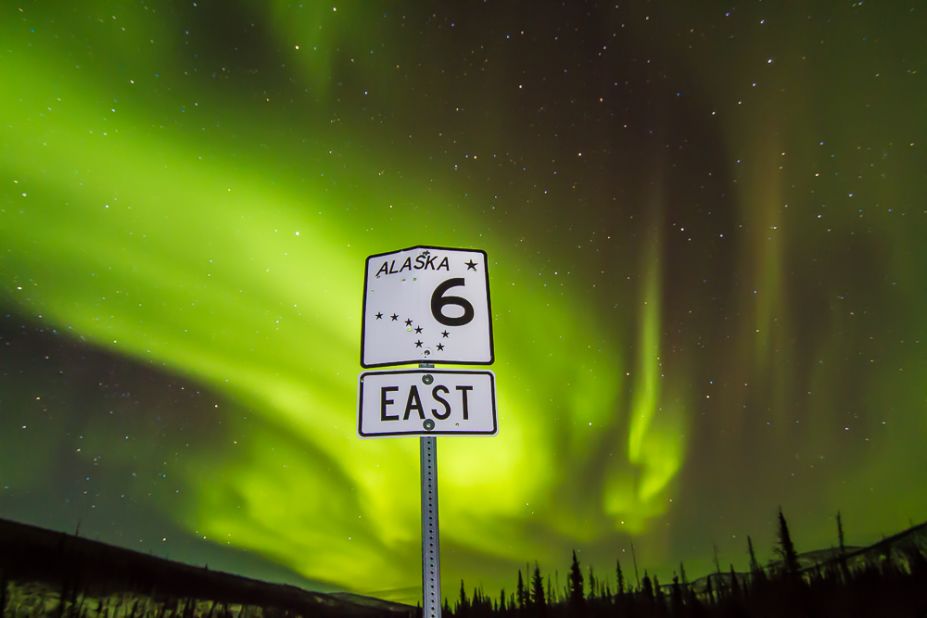 About 65 miles north of Fairbanks at 3:30 a.m. and -11 degrees F (-24 C), a dazzling aurora inspired an audience of one to turn a Steese Highway sign into art.