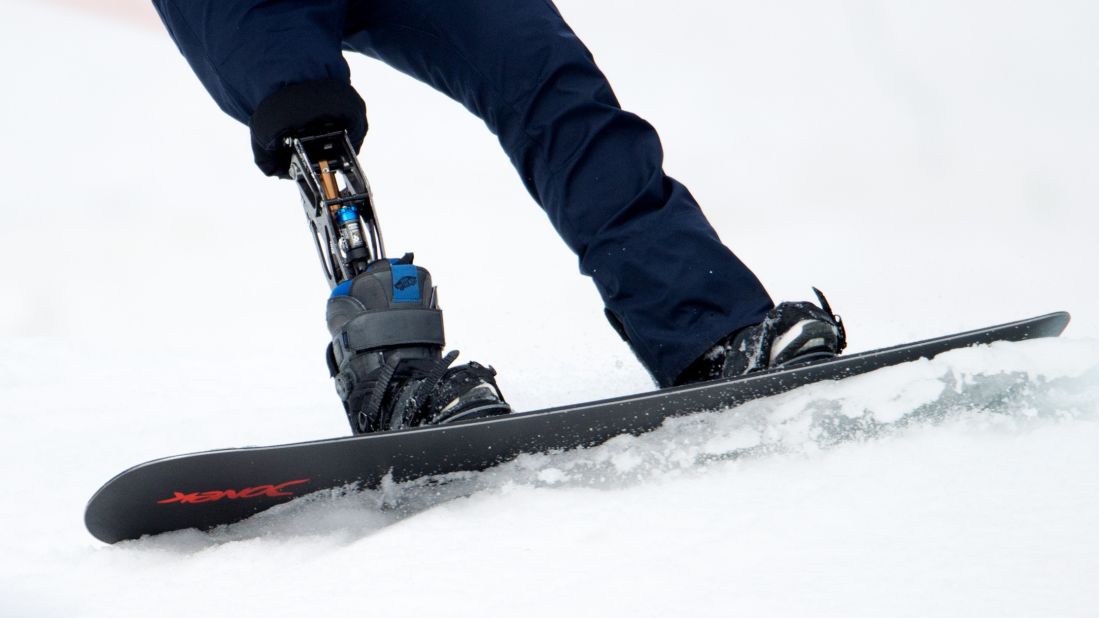 A snowboarder with a lower limb prosthesis competes on March 14.