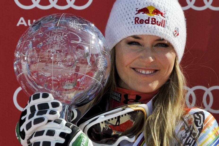 American skier Lindsey Vonn poses with her Crystal Globe after claiming the overall title in March 2012.
