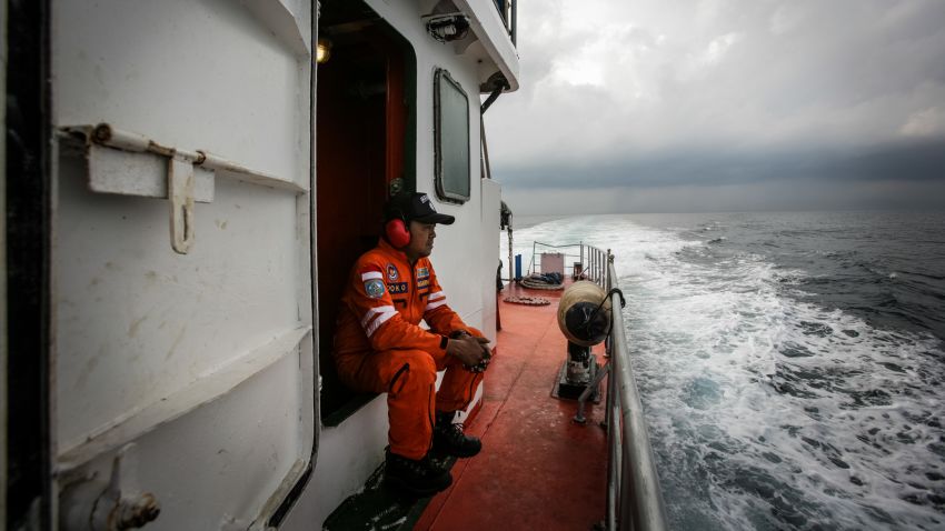 Indonesian national search and rescue agency personel watch over high seas during a search operation for missing Malaysia Airlines flight MH370 in the Andaman Sea on March 15, 2014. Investigators now believe a Malaysian jet that vanished was commandeered by a "skilled, competent" flyer who piloted the plane for hours, a senior Malaysian military official said on March 15 as Prime Minister Najib Razak prepared to address the nation.