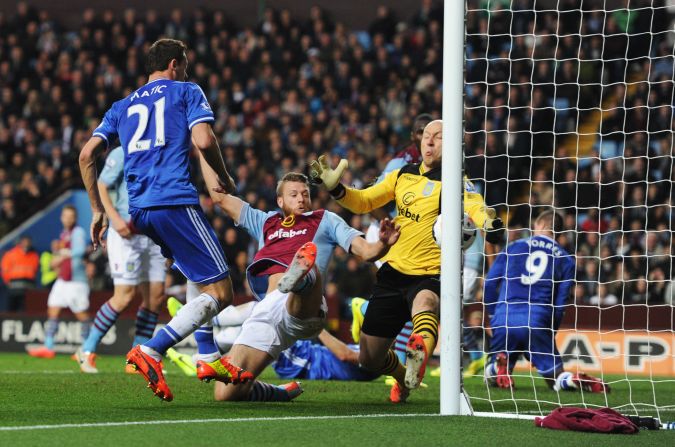 However, the former Everton and Manchester United player has been replaced in the U.S. goal by Brad Guzan  -- in yellow -- whose English club Aston Villa has dropped out of the Premier League. 