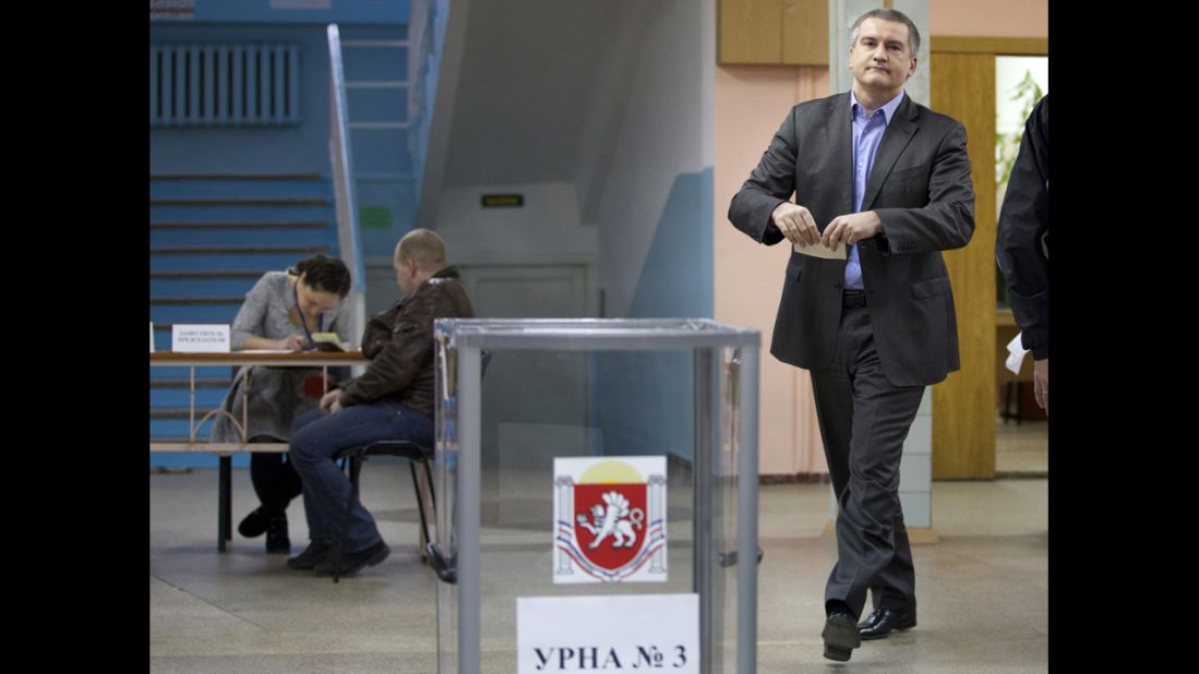 The newly installed pro-Russian leader of Crimea, Sergey Aksyonov, casts his ballot at a polling station. He called on the residents of Crimea to cast their votes "independent of nationalism and disintegration."