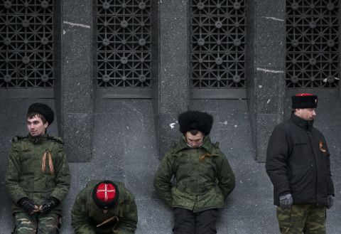 Cossacks guard the regional parliament building during the Crimean referendum in Simferopol. 