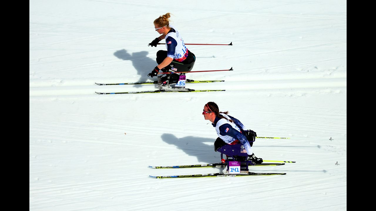 Beth Requist and Tatyana McFadden of the United States compete in the women's cross-country 5-kilometer sitting event.
