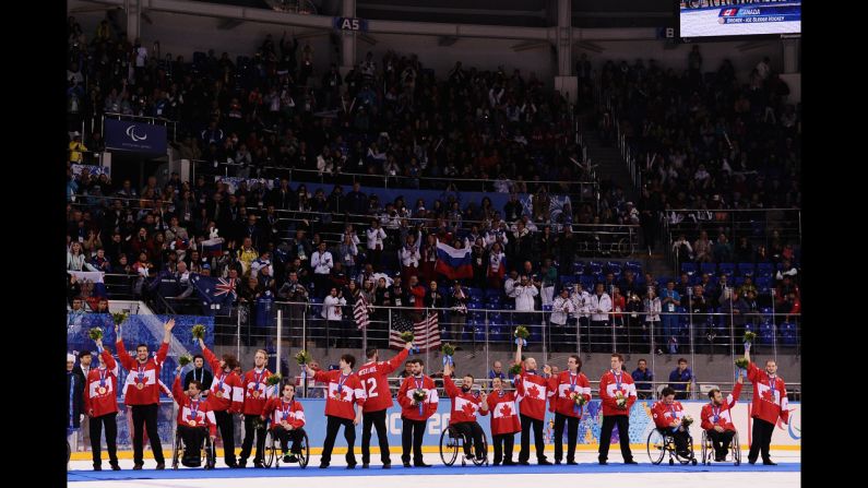 Canadian players react during the medal ceremony after the ice sledge hockey gold medal game between the Russian Federation and the United States on Saturday, March 15. The United States won, 1-0.