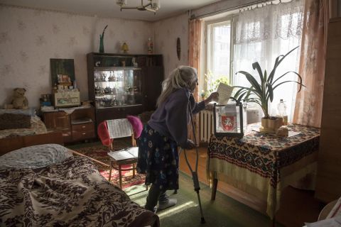 Solodkova Natalia, who was not healthy enough to visit a polling station, casts her vote at her home in Bakhchysaray, Ukraine, on March 16.