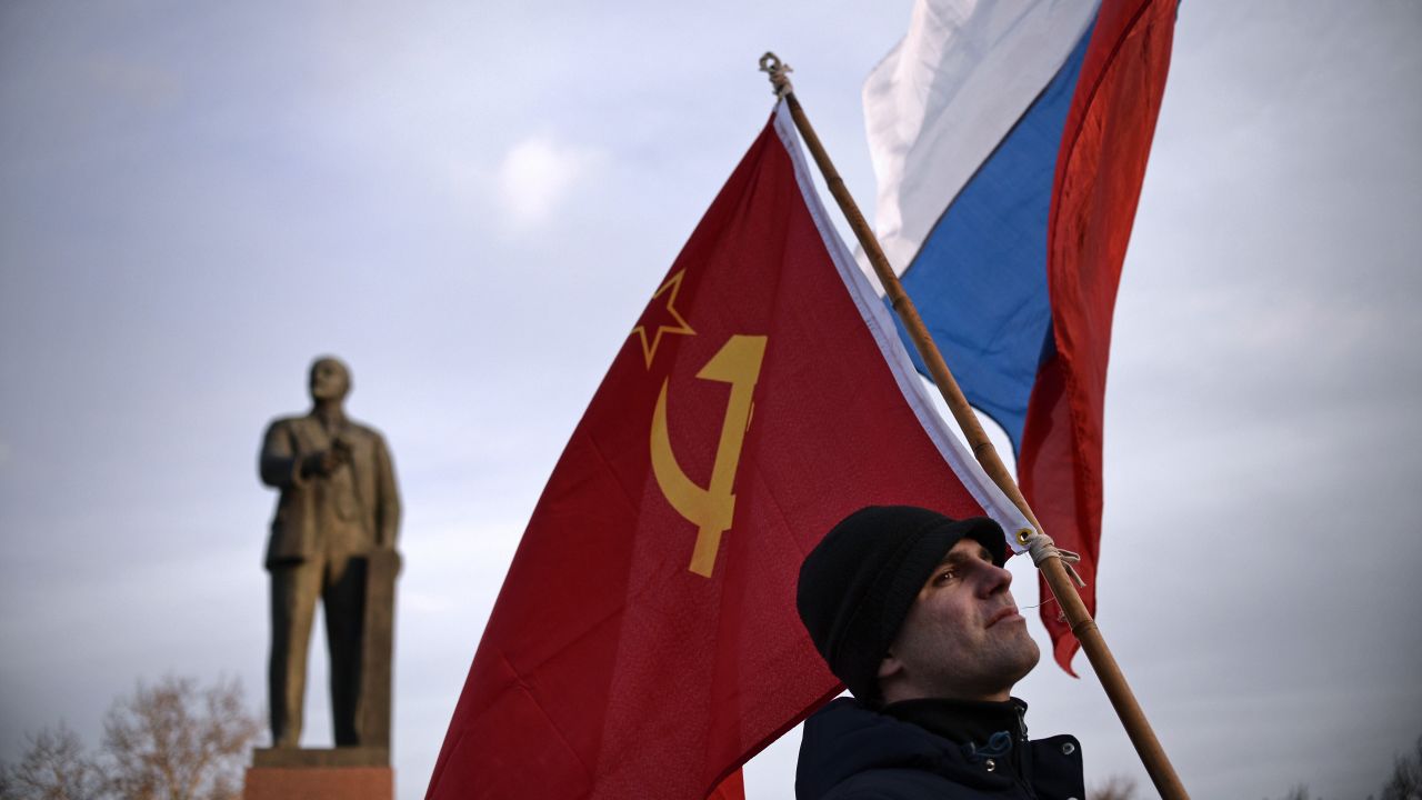 A Crimean man holds a Soviet Union flag in Lenin Square in Simferopol, Ukraine, on March 16.