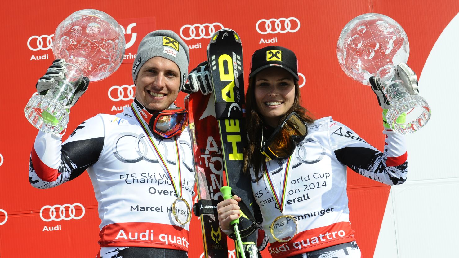 Marcel Hirscher (L) and Austria's Anna Fenninger celebrate with their Globe trophies. 