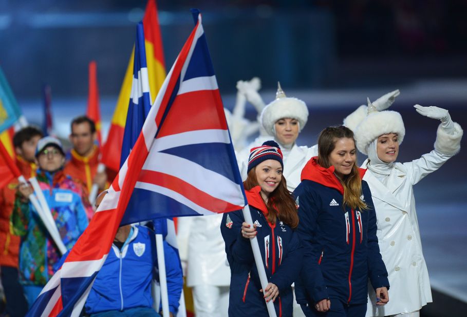 Flag bearer and Alpine skier Jade Etherington of Great Britain enters the stadium during Closing Ceremony.