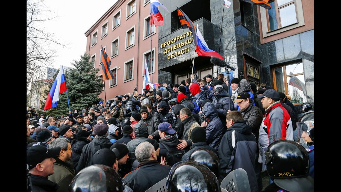 Pro-Russia demonstrators storm the prosecutor general's office during a rally in Donetsk on March 16.