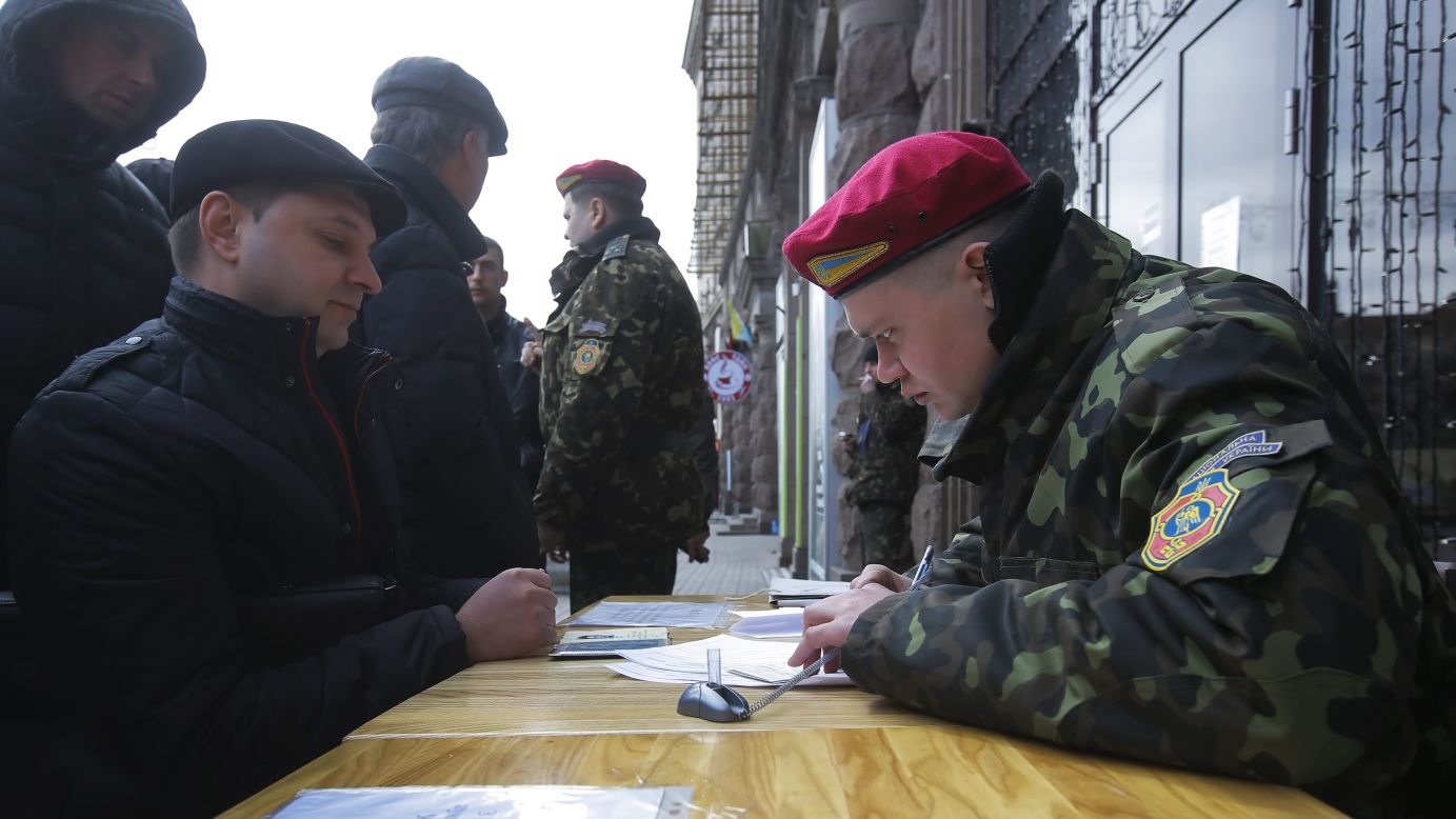 A Ukrainian man applies for the National Guard at a mobile recruitment center in Kiev on March 17.