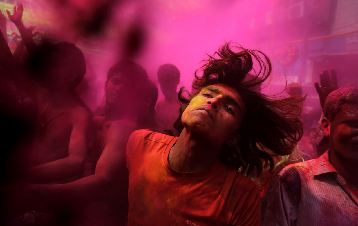 MARCH 17 - GAUHATI, INDIA: With faces smeared with colored powder, Indians dance during celebrations marking <a href="http://ireport.cnn.com/docs/DOC-1107646?ref=feeds%2Flatest">Holi, the Hindu festival of colors.</a> The occasion also marks the advent of spring.