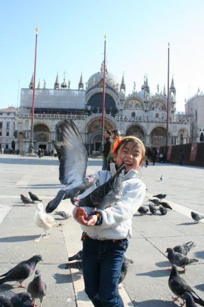 CNN asked its readers to share their successes traveling with their children. <a href="http://ireport.cnn.com/docs/DOC-1096138">Almira Coronado</a> and her husband took their daughter, Michelle, to Italy when she was 5, where her most memorable moment was feeding the pigeons at Piazza San Marco in Venice. "My husband and I really try to explain new things to Michelle so that she knows what to expect or at least has a better understanding of what's going on." 