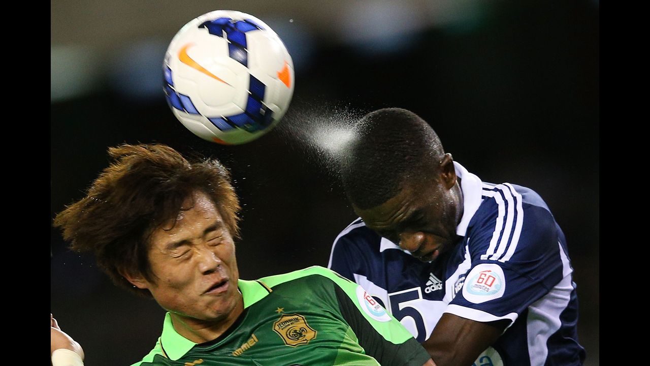Sweat sprays off the head of Jason Geria of the Melbourne Victory as he heads the ball away from Choi Bo-Kyung of Joenbuk Hyundai Motors during an Asian Champions League match in Melbourne on Wednesday, March 12.