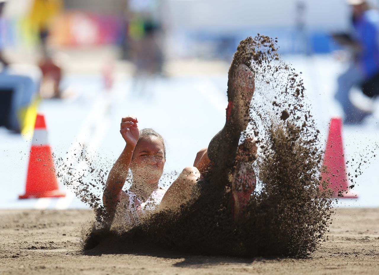Venezuelan long jumper Yuliana Angulo Jama lands Thursday, March 13, during the South American Games in Santiago, Chile.