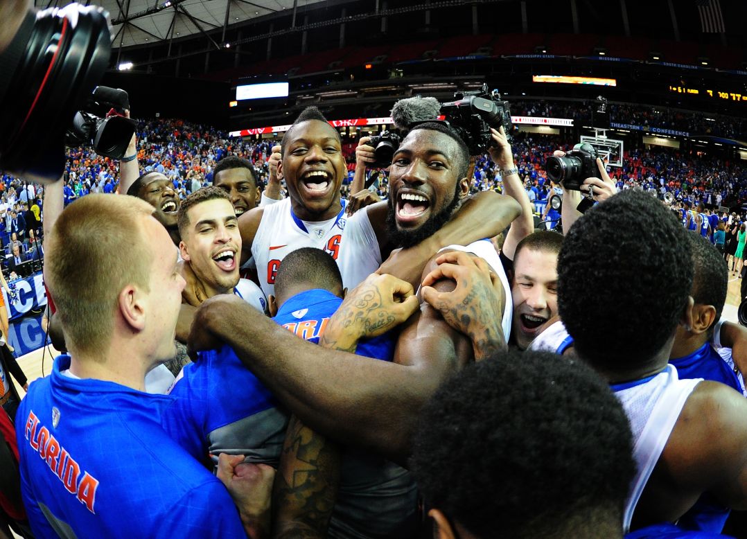 Members of the Florida Gators men's basketball team celebrate Sunday, March 16, after winning the SEC tournament final against Kentucky.