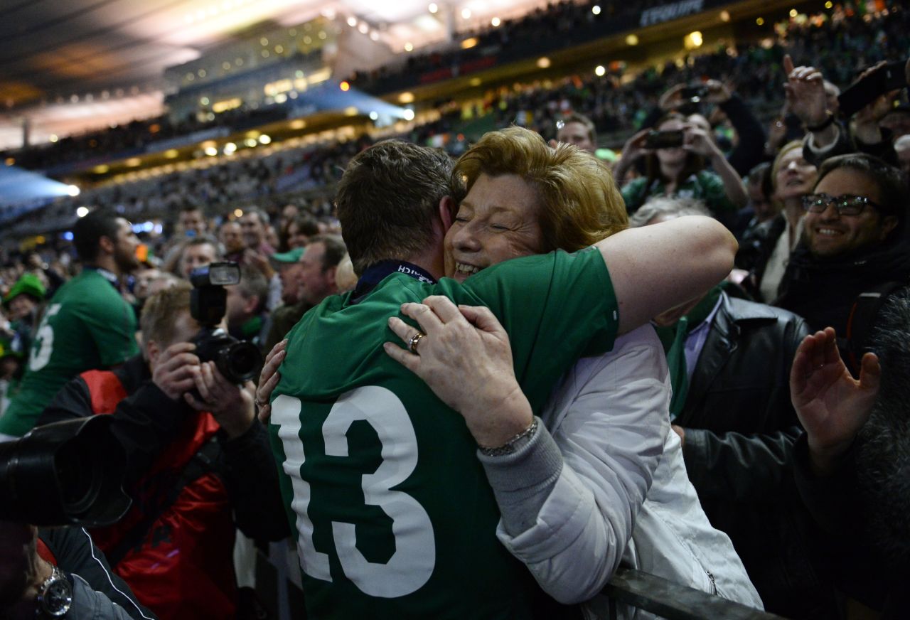 Ireland's Brian O'Driscoll hugs his mother, Geraldine, after his team won the Six Nations rugby match against France on Saturday, March 15, in Paris. The win clinched the championship for Ireland. 