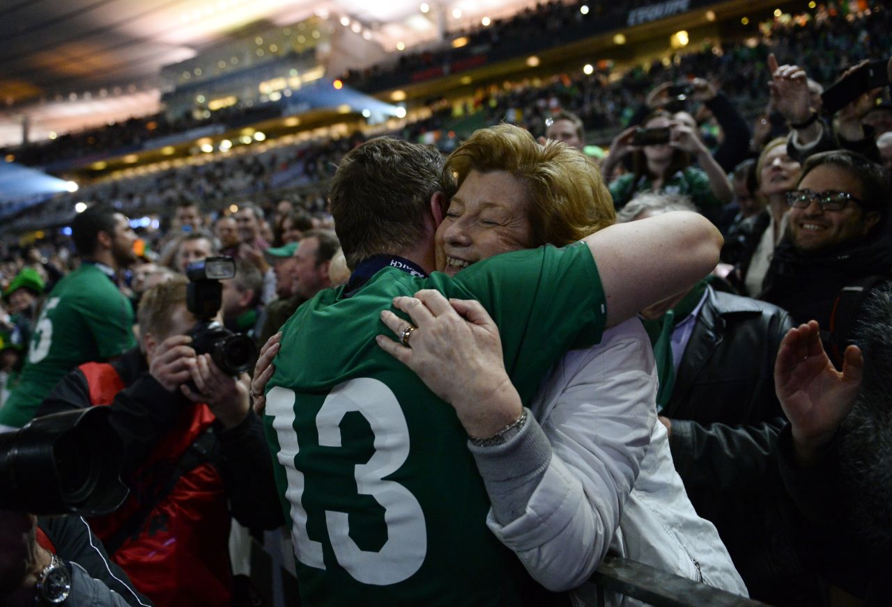 Ireland's Brian O'Driscoll hugs his mother, Geraldine, after his team won the Six Nations rugby match against France on Saturday, March 15, in Paris. The win clinched the championship for Ireland.