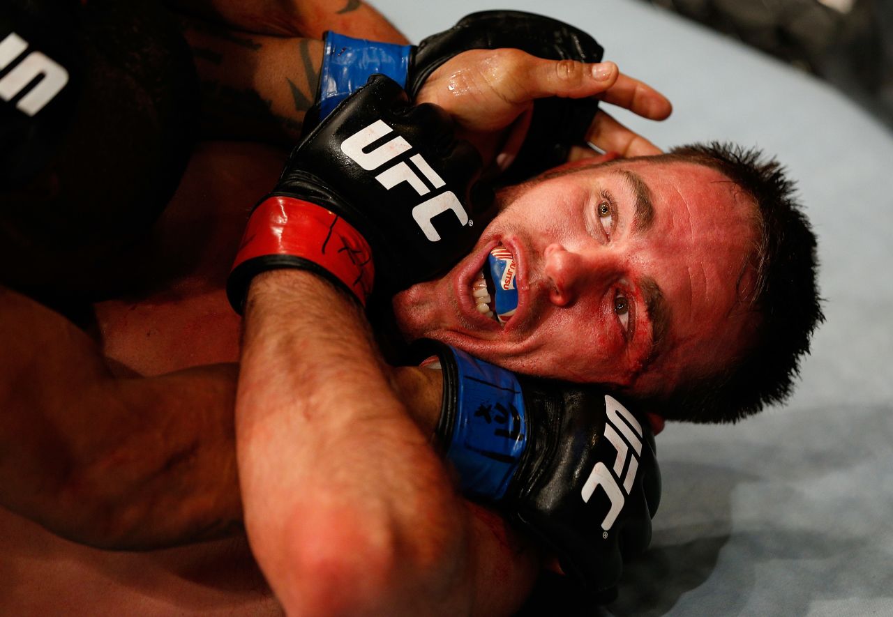 Jake Shields is locked in a hold by Hector Lombard during their welterweight bout at UFC 171, which was held Saturday, March 15, in Dallas.