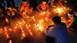 People attend a vigil for the missing Malaysian Airlines plane in Phnom Penh, Cambodia, on Monday, March 17.