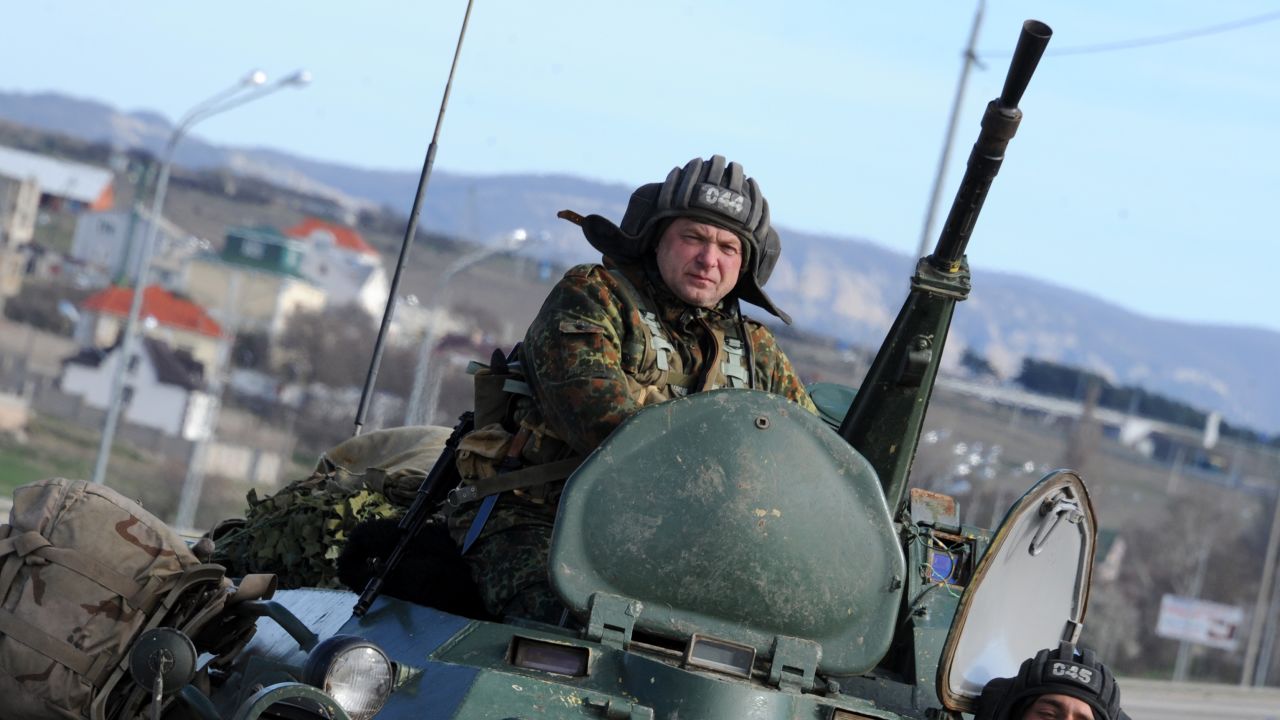 A Russian armoured vehicle drives on the road between Simferopol and Sevastopol on March 17, 2014.