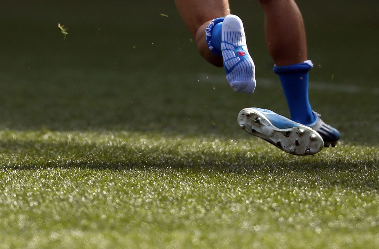 Italy's Michele Campagnaro loses his shoe during a Six Nations rugby match against England on Saturday, March 15, in Rome.