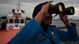 A member of Indonesia's National Search and Rescue looks over the horizon during a search in the Andaman sea area around northern tip of Indonesia's Sumatra island for the missing Malaysia Airlines jet on Monday, March 17.