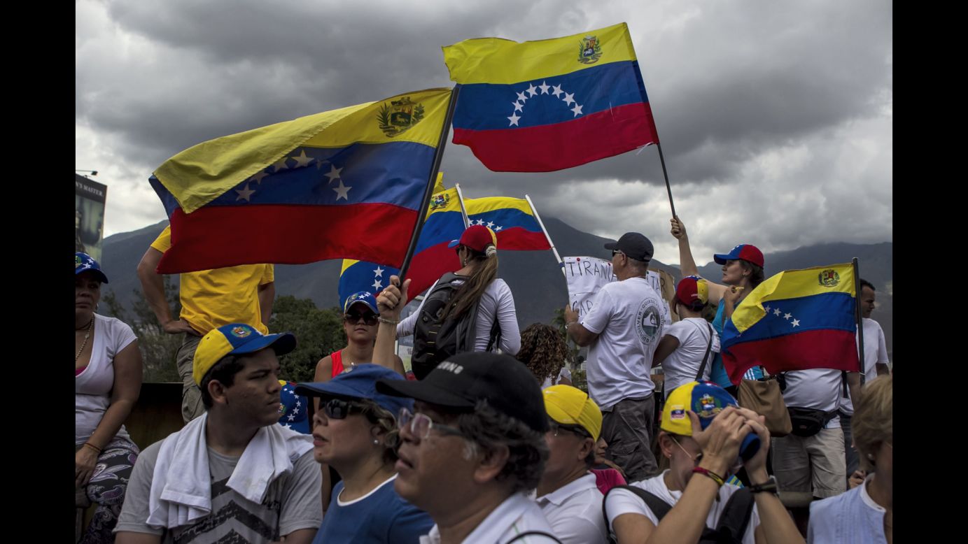 People take part in a protest against President Nicolas Maduro in Caracas on Sunday, March 16. 