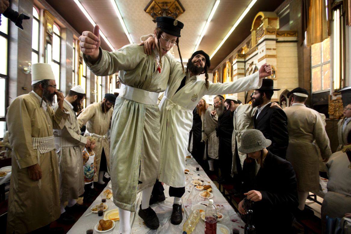 MARCH 18 - JERUSALEM: Ultra-Orthodox Jewish men in costumes dance at a yeshiva, a Jewish school, during Purim celebrations. The festival commemorates the rescue of Jews from genocide in ancient Persia, recorded in the book of Esther in the Bible.  