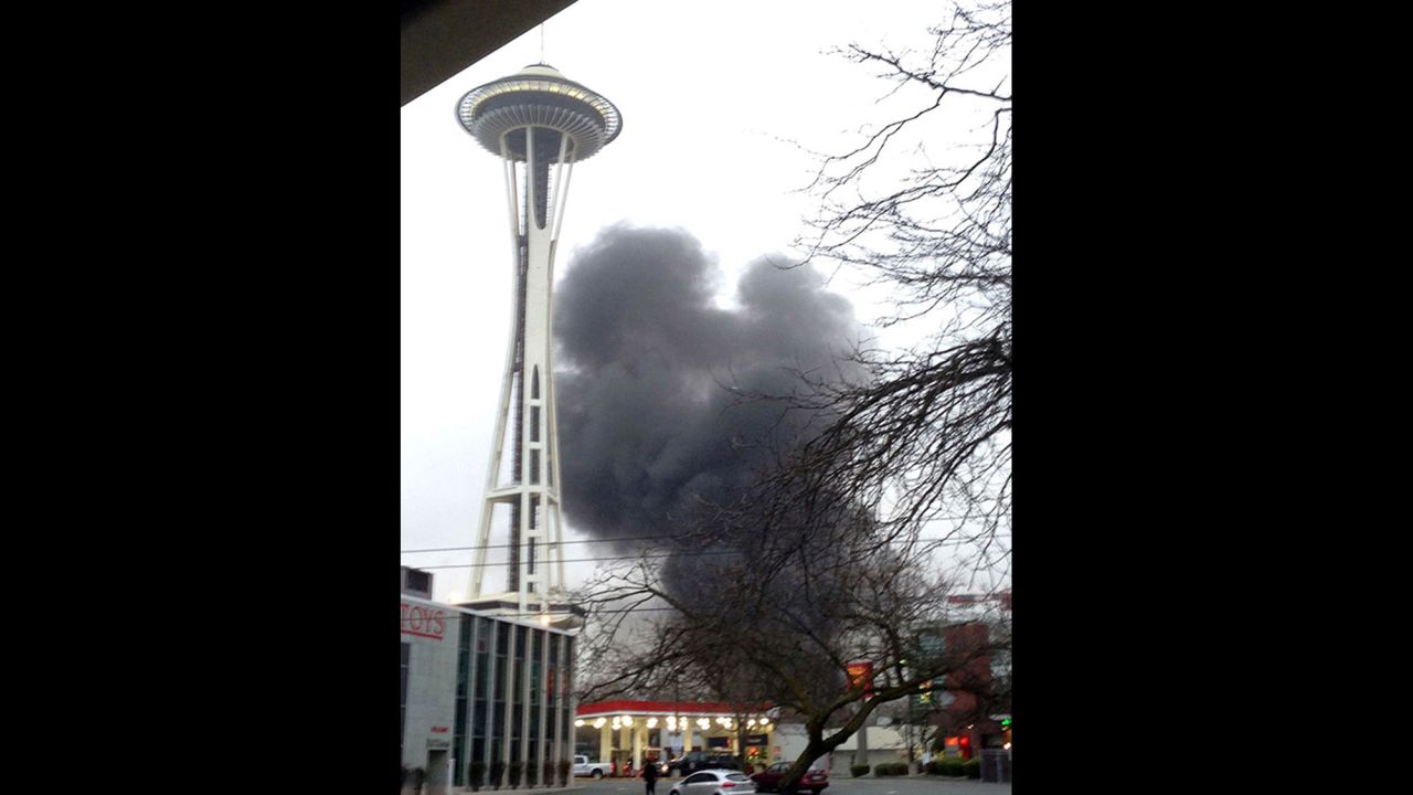 Smoke rises from the crash site.