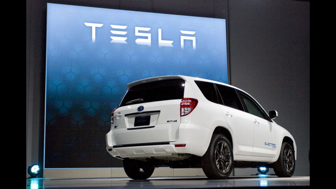 Tesla RAV4 EV is displayed at an auto show. 