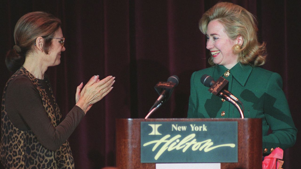 Steinem applauds first lady Hillary Clinton at Clinton's address to the New York Women's Agenda in 1995.
