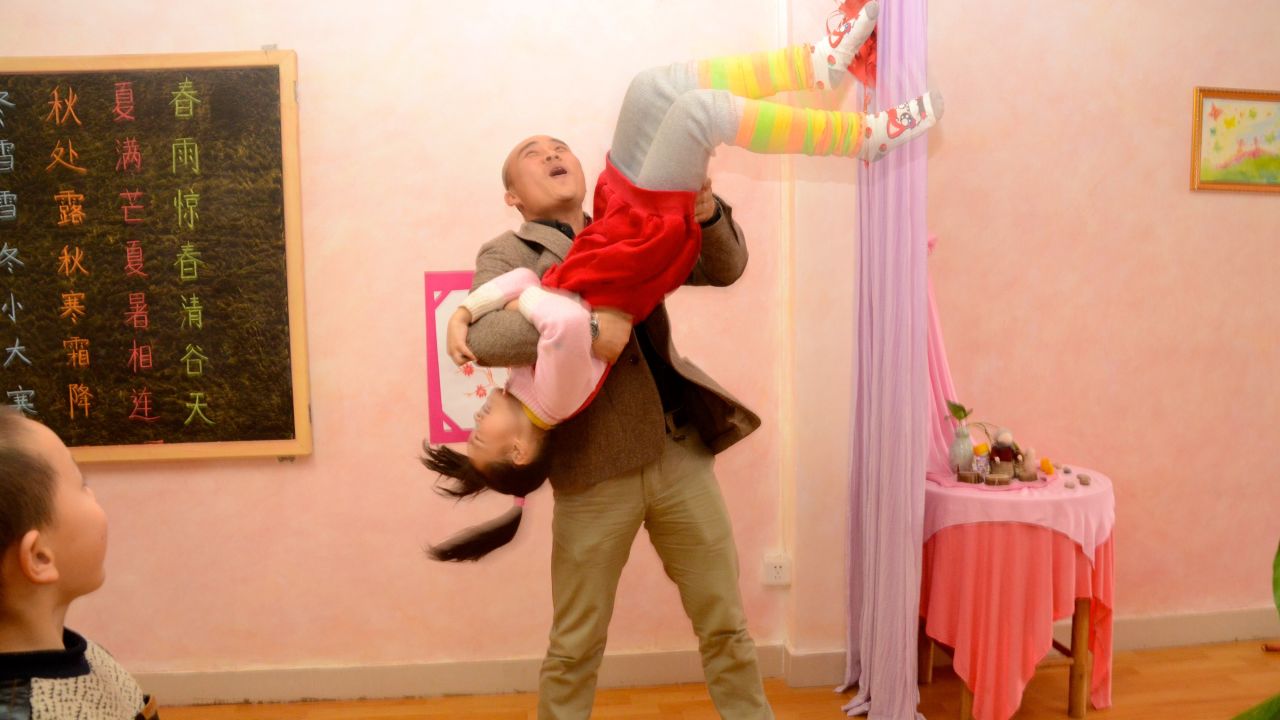 Headmaster Wei Yueling gets playful with his students.