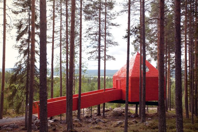 <em>Blue Cone (Treehotel), Sweden</em><br /><br />Boldly standing out among the trees, this bright crimson hotel room in the Swedish countryside is almost child-like in its outer design. The beautifully simplified structure almost resembles a Lego block, and the guiding idea behind the <a  target="_blank" target="_blank">Sandell Sandberg</a> studio's design was to make it accessible.  <br /><br />Unlike most other forest cottages, Blue Cone is not meant to blend in with the surroundings, but act as a prominent landmark that attracts visitors from a far. 