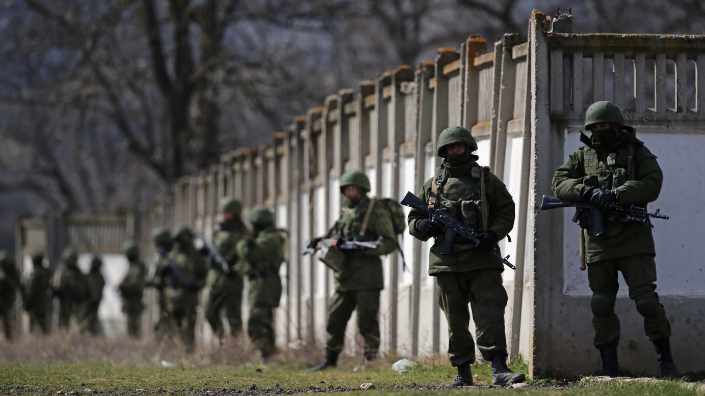 Russian military personnel surround a Ukrainian military base in Perevalne on March 19.
