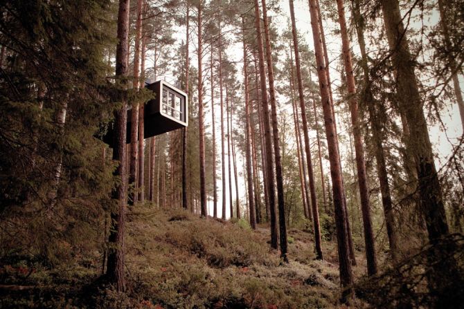 <em>The Cabin (Treehotel), Sweden</em><br /><br />Hovering high up above a river valley, this gravity-defying tree-house looks almost like a futuristic ship lodged between the forest's ancient trees. It's the brainchild of the architectural sibling duo <a  target="_blank" target="_blank">M?rten and Gustav Cyrén</a> who got the idea while on a fishing trip in the Russian forest: "The weather was poor and the fishing equally bad, so we huddled around the campfire and started talking about a remote guesthouse in Sweden that we knew of. Something special was needed to put the spotlight on this place, with its nature and its dramatic change of seasons." <br /><br />The cabin is accessed is through a bridge that cuts through the forest floor, and inside the bed is centrally located so that the stunning panorama is the first thing you see when you wake up.