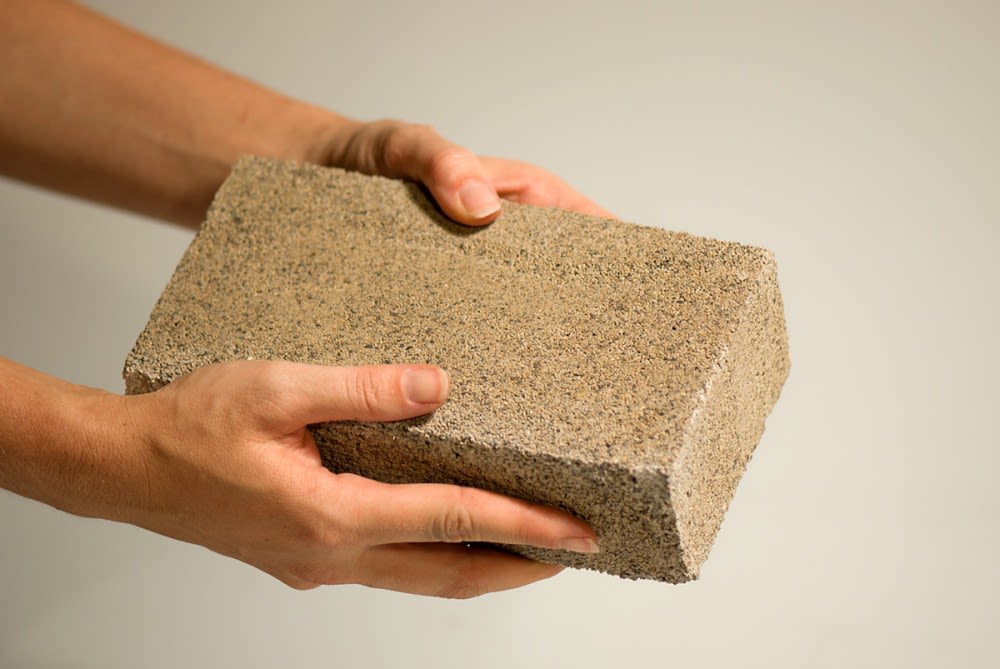 Researchers make bricks from waste, desert sand