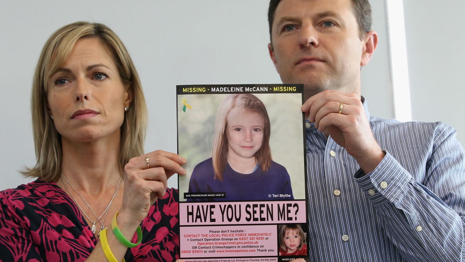 Kate and Gerry McCann hold an age-progressed police image of their daughter Madeleine during a news conference to mark the 5th anniversary of her disappearance, on May 2, 2012.