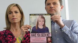 Kate and Gerry McCann hold an age-progressed police image of their daughter Madeleine five years after her disappearance.