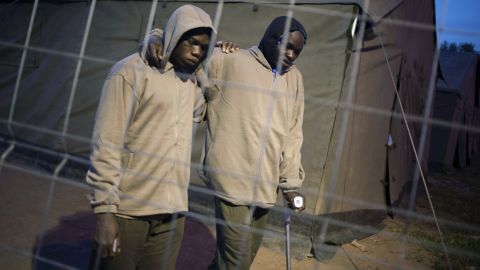 Immigrants walk between freshly erected tents in The Spanish enclave of Melilla on March 18, 2014. 