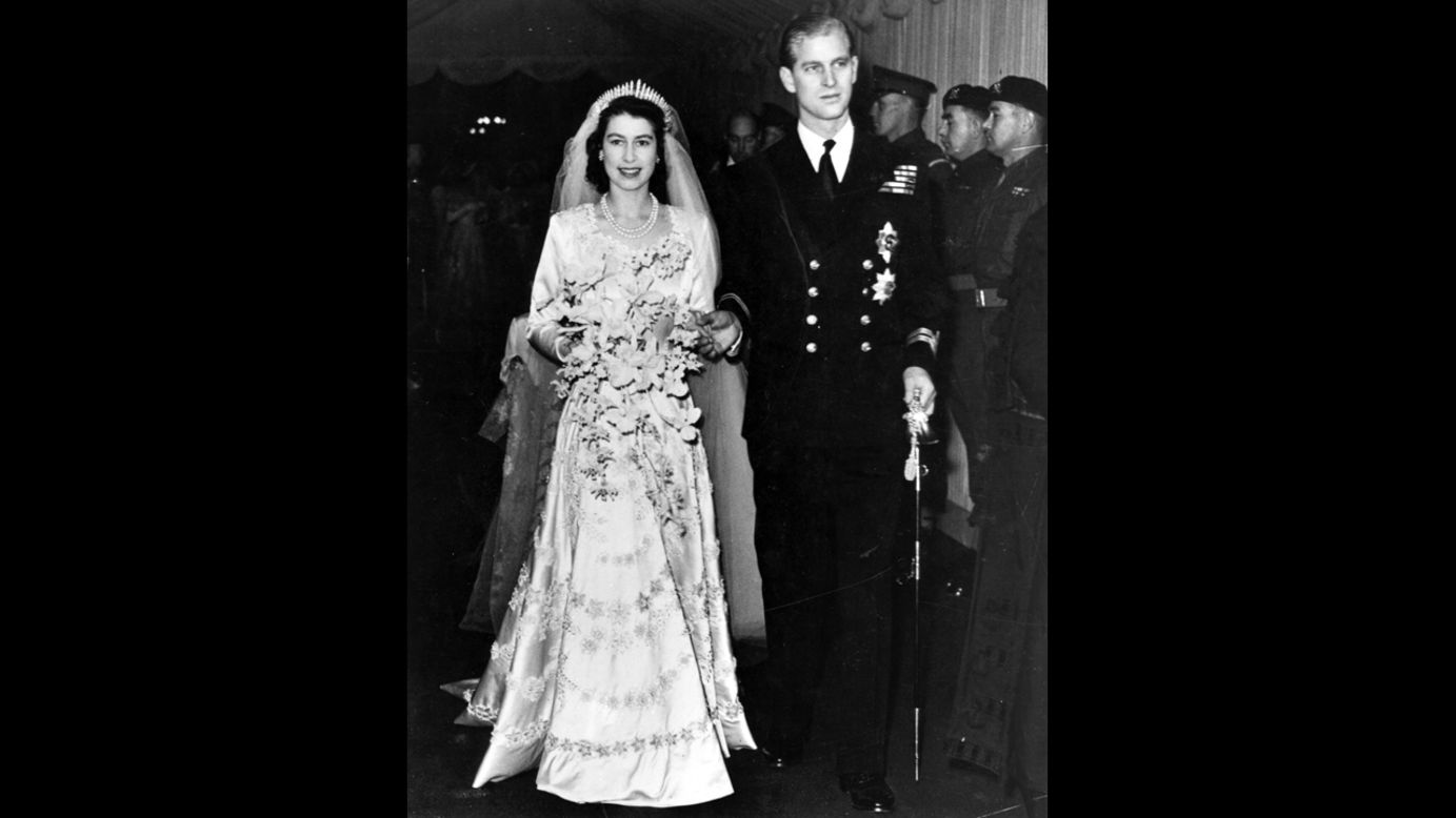 Queen Elizabeth II, as Princess Elizabeth, and her husband the Duke of Edinburgh, styled Prince Philip in 1947, on their wedding day. She became queen on her father King George VI's death in 1952.  