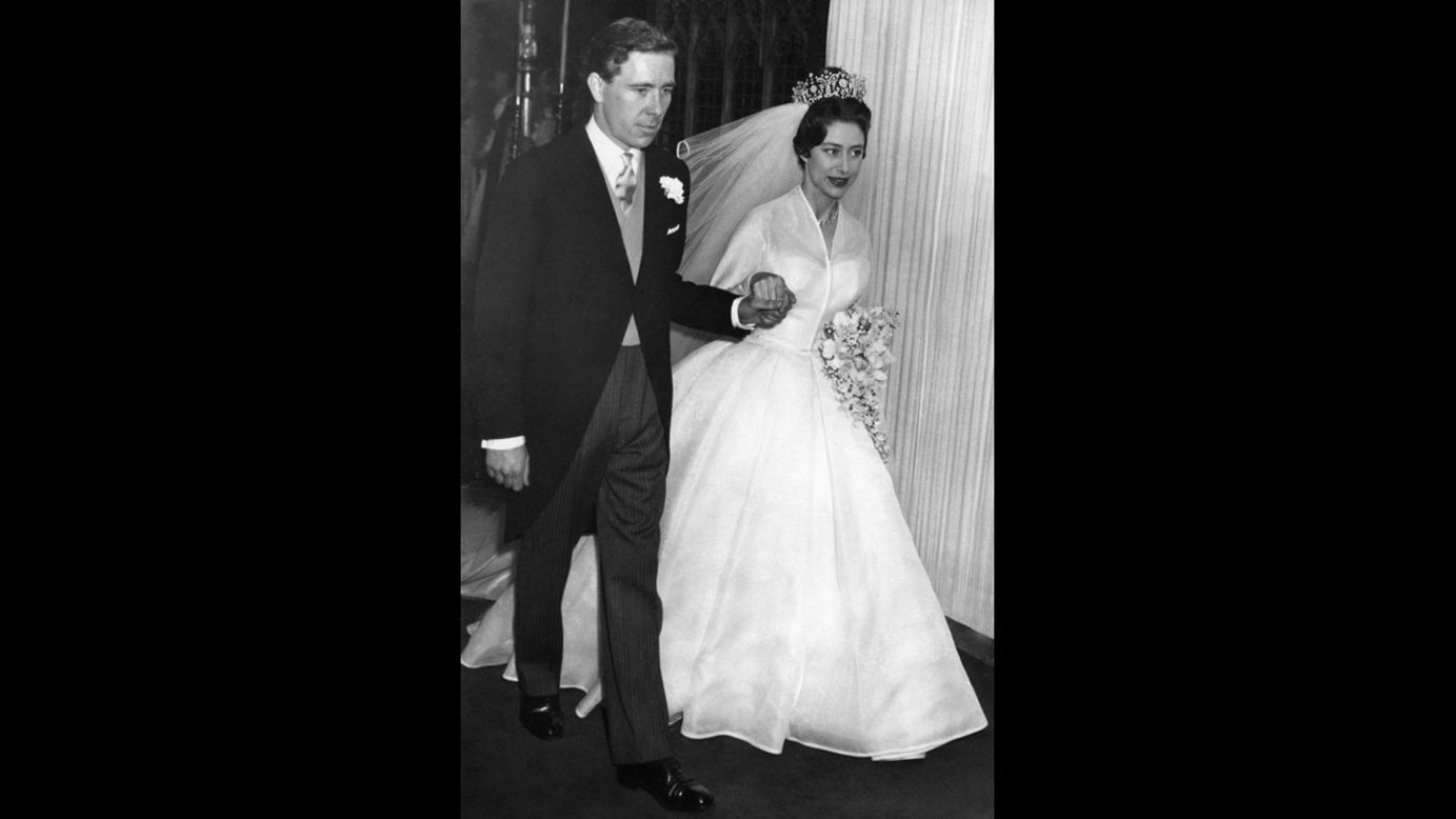 The newly-wed Princess Margaret, the younger sister of Britain's Queen Elizabeth II, leaves hand in hand with her husband the photographer Antony Armstrong-Jones London's Westminster Abbey on their wedding day May 6, 1960.  Armstrong-Jones was later made Earl of Snowdon. When the marriage was officially ended two years later, Margaret became the first royal to divorce since Henry VIII in the 16th century. 