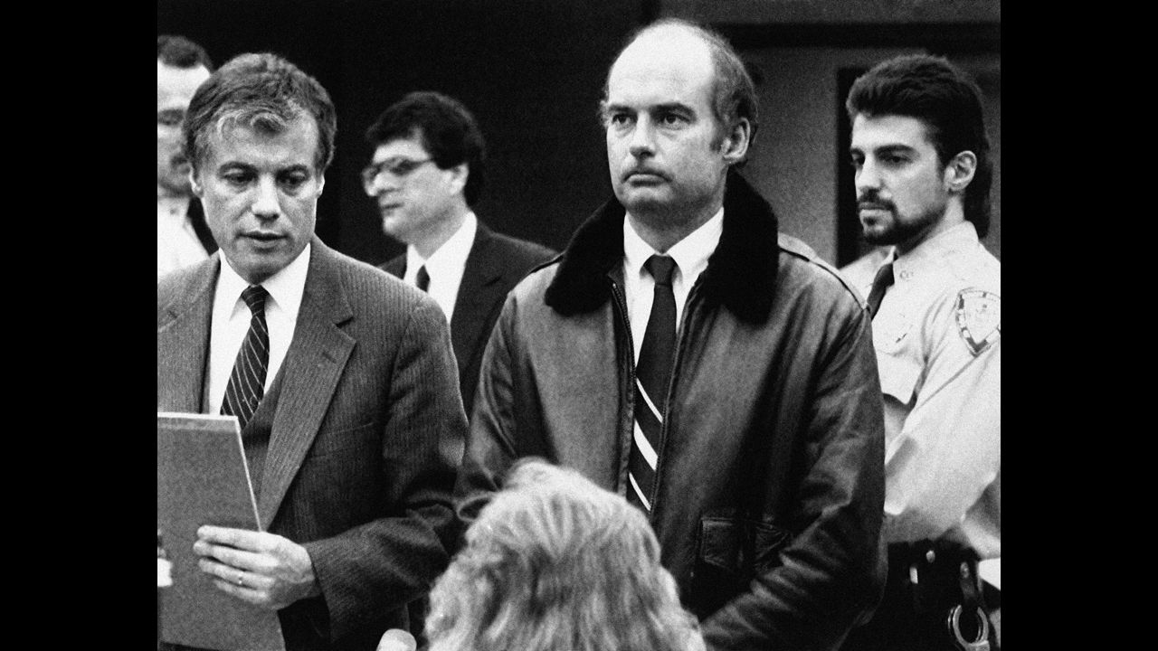 Capt. Joseph Hazelwood, center, stands with his attorney during his arraignment on fugitive charges stemming from the grounding of the Exxon Valdez. An Alaska jury  cleared him on a felony charge but he was convicted of negligent discharge of oil, a misdemeanor, for which he performed community service.
