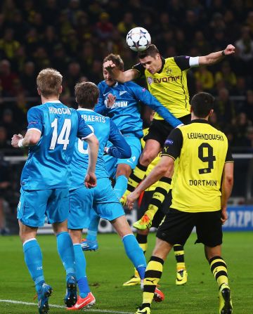 Sebastian Kehl scored for Borussia Dortmund as the 2013 finalist advanced past Zenit St. Petersburg in the other Champions League game. Dortmund lost 2-1 Wednesday but went through 5-4 on aggregate.  