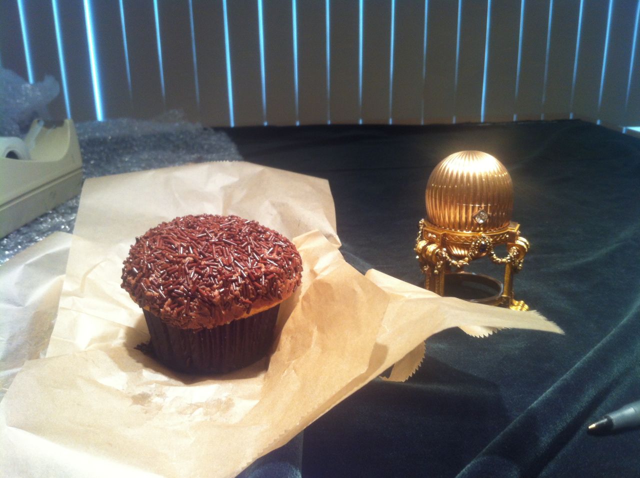 The Third Imperial Egg as seen by Faberge expert Kieran McCarthy for the first time in the United States. The cupcake beside it demonstrates the egg's delicacy.