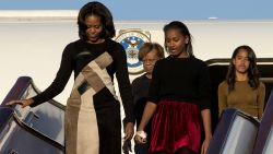 BEIJING, CHINA - MARCH 20:  First Lady Michelle Obama with her mother Marian Robinson, daughters Sasha Obama and Malia Obama arrives at Beijing Capital International Airport on March 20, 2014 in Beijing, China. The first lady arrived in Beijing with her mother, Marian Robinson, and daughters to kick off a six-day tour where she will focus on education and cultural exchange. (Photo by Alexander F. Yuan/Getty Images)